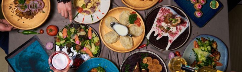 a group of people at a restaurant table