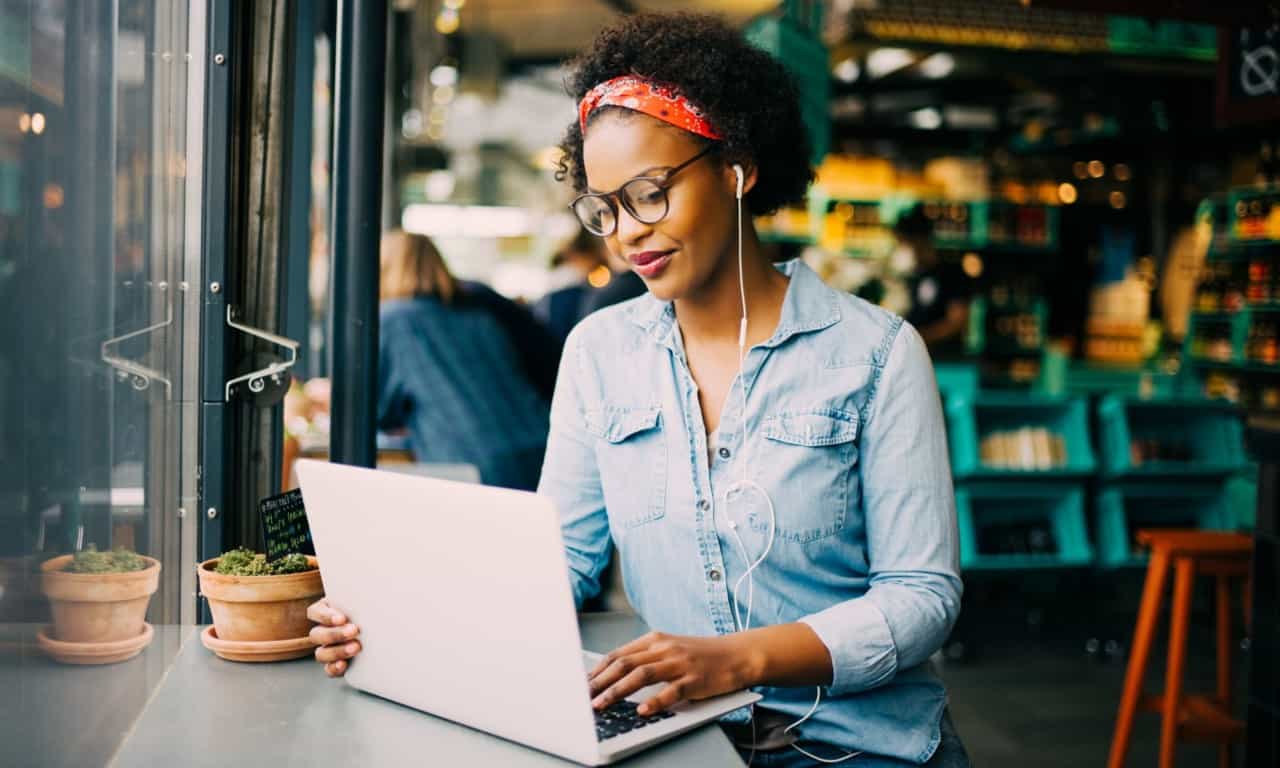 a woman listening to feedback to improve customer retention through social media